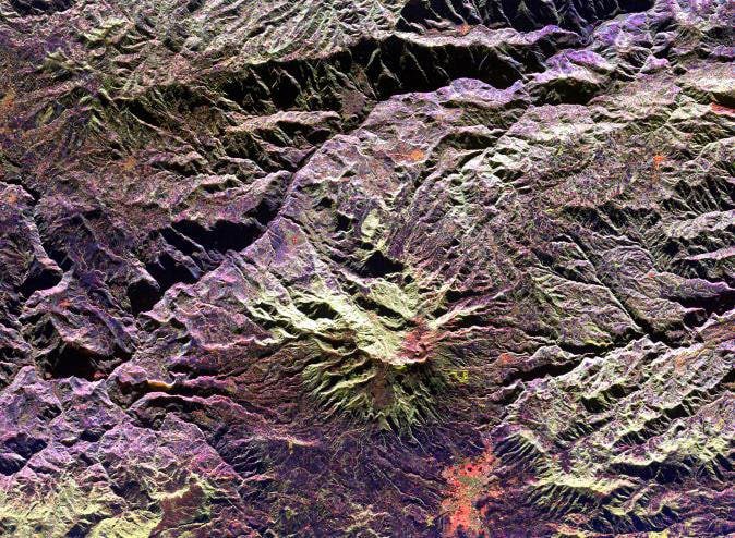 The image shows the Space radar image of Galeras Volcano. World Insurance Companies Logos - Colombia, Latin America