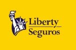 The Liberty Seguros logo features The Statue of Liberty and a serif-style word mark to its right. The image in light saturated yellow, and blue conveys professionalism, experience, and authority – World Insurance Companies Logos.